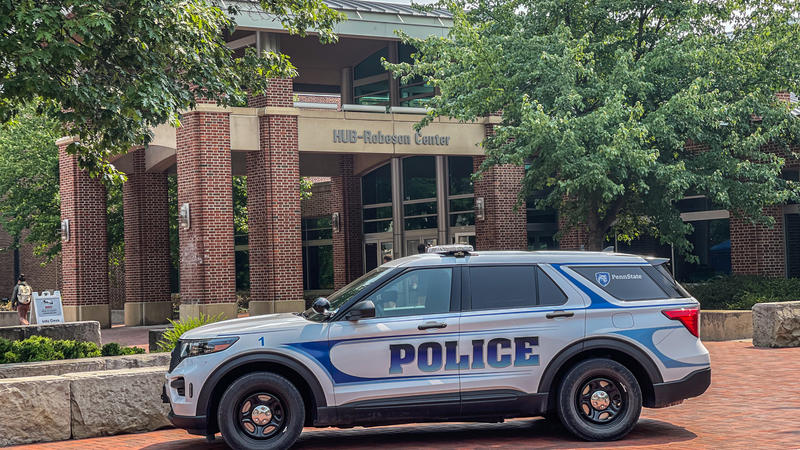 Police Cruiser parked in front of the HUB-Robeson Center at University Park